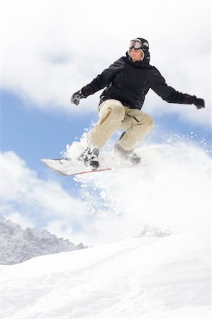 simsearch:400-03985663,k - snowboarder taking jump in fresh powder snow Stock Photo - Budget Royalty-Free & Subscription, Code: 400-04012377
