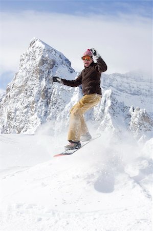 simsearch:400-03985663,k - snowboarder taking jump in fresh powder snow Stock Photo - Budget Royalty-Free & Subscription, Code: 400-04012378