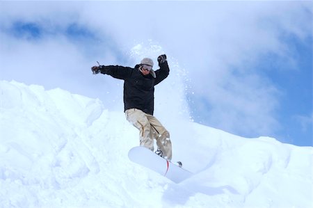 simsearch:400-03985663,k - snowboarder taking jump in fresh fallen snow Stock Photo - Budget Royalty-Free & Subscription, Code: 400-04013569