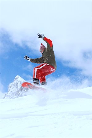 simsearch:400-03985663,k - snowboarder taking jump in fresh fallen snow Stock Photo - Budget Royalty-Free & Subscription, Code: 400-04013570