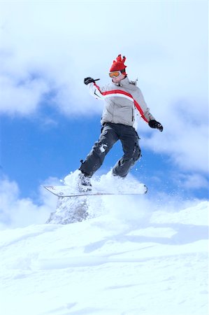 simsearch:400-03985663,k - snowboarder taking jump in fresh fallen snow Stock Photo - Budget Royalty-Free & Subscription, Code: 400-04013572