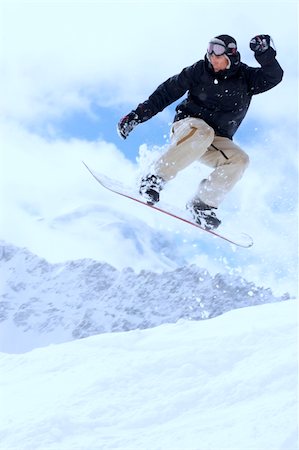 simsearch:400-03985663,k - snowboarder taking jump in fresh fallen snow Stock Photo - Budget Royalty-Free & Subscription, Code: 400-04013573