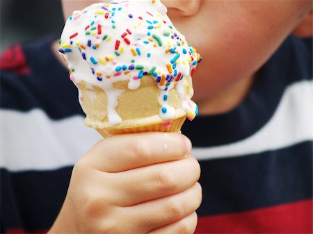 simsearch:400-05718903,k - a young child's hand holding a dripping ice cream cone with colorful sprinkles Stock Photo - Budget Royalty-Free & Subscription, Code: 400-04013759