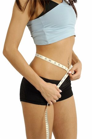 simsearch:400-07219376,k - A tanned slim young woman measuring her waistline. Stock Photo - Budget Royalty-Free & Subscription, Code: 400-04025306