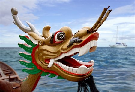 An empty Chinese Dragon racing boat waiting in the water. Stock Photo - Budget Royalty-Free & Subscription, Code: 400-04020095