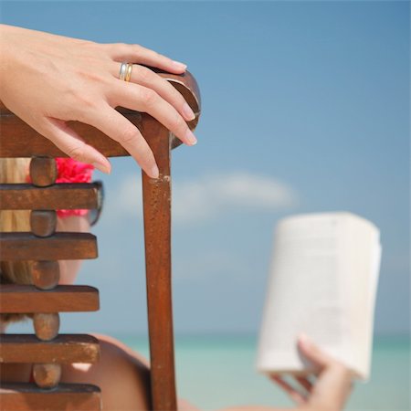 simsearch:6109-06004195,k - Woman reading in deckchair on tropical beach. Stock Photo - Budget Royalty-Free & Subscription, Code: 400-04020329