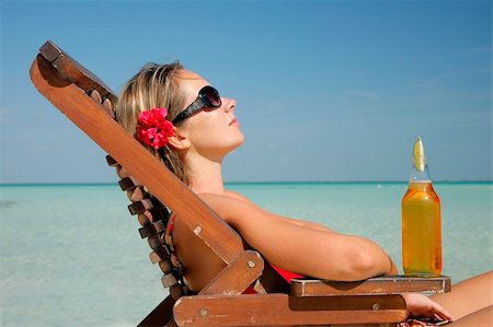 simsearch:6109-06004195,k - Woman in deckchair with beer Stock Photo - Budget Royalty-Free & Subscription, Code: 400-04020330