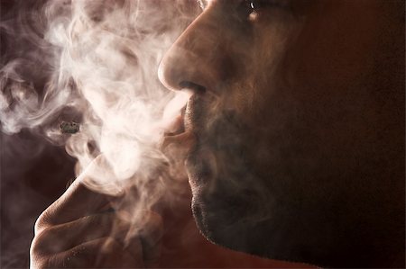 simsearch:400-05207678,k - close up of an smoking man Stock Photo - Budget Royalty-Free & Subscription, Code: 400-04020737