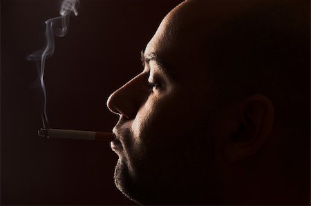 simsearch:400-05207678,k - close up of an smoking man Stock Photo - Budget Royalty-Free & Subscription, Code: 400-04020739