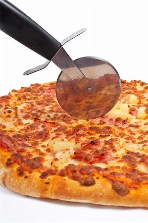 simsearch:400-04479187,k - Tasty Italian pizza and cutter, isolated on white background. Shallow DOF Stock Photo - Budget Royalty-Free & Subscription, Code: 400-04021543