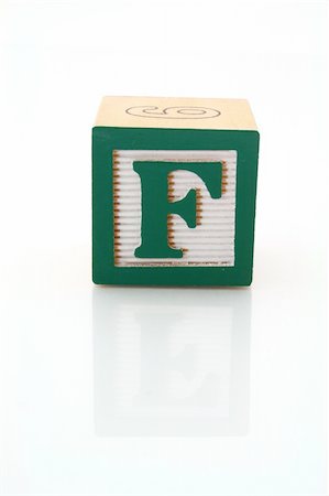 simsearch:600-02346205,k - letter f on a wood block over a reflective surface Stock Photo - Budget Royalty-Free & Subscription, Code: 400-04021569
