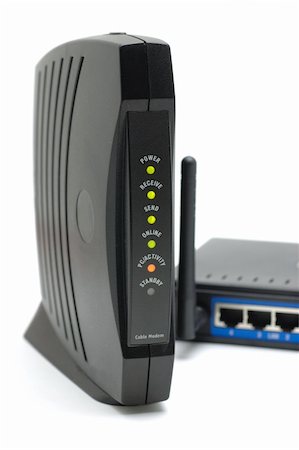 Cable modem and wireless router in isolated white background Foto de stock - Super Valor sin royalties y Suscripción, Código: 400-04022570