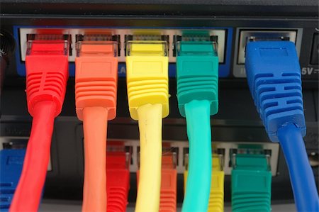 Close up of multi color cables connected to a router Foto de stock - Super Valor sin royalties y Suscripción, Código: 400-04022611