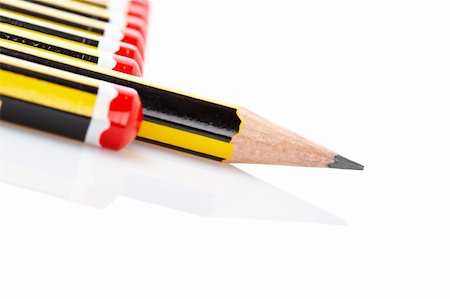 Assortment of pencils reflected on white background. Shallow depth of field Stock Photo - Budget Royalty-Free & Subscription, Code: 400-04023750