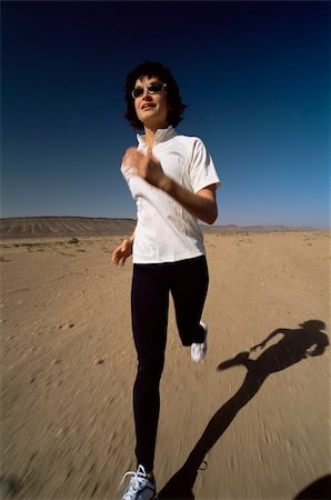 simsearch:400-04535435,k - Young woman jogging in desert Stock Photo - Budget Royalty-Free & Subscription, Code: 400-04034954