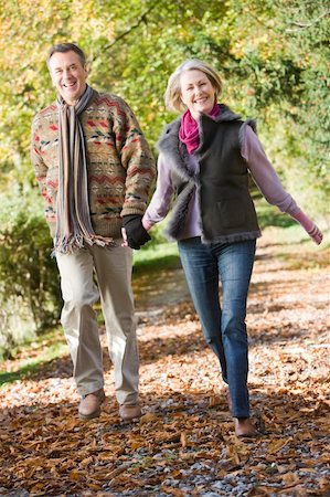 simsearch:400-04035087,k - Senior couple walking along path in autumn woods Stock Photo - Budget Royalty-Free & Subscription, Code: 400-04035007