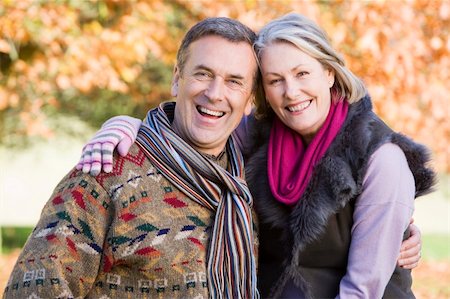 simsearch:400-04035087,k - Affectionate senior couple on autumn walk with trees in background Stock Photo - Budget Royalty-Free & Subscription, Code: 400-04035050