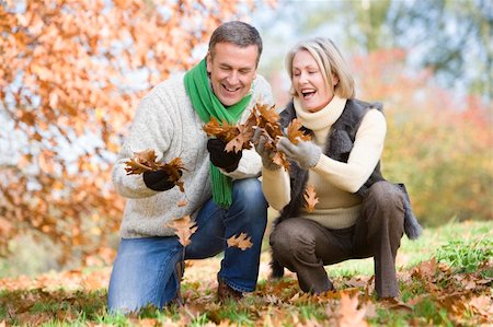simsearch:400-04035087,k - Senior couple collecting autumn leaves together Stock Photo - Budget Royalty-Free & Subscription, Code: 400-04035075