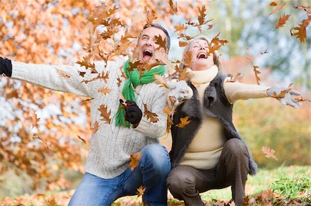 simsearch:400-04035087,k - Senior couple throwing autumn leaves in the air Stock Photo - Budget Royalty-Free & Subscription, Code: 400-04035076