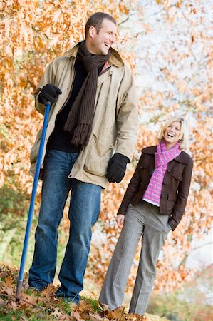 simsearch:400-04035087,k - Couple raking up autumn leaves in garden Stock Photo - Budget Royalty-Free & Subscription, Code: 400-04035132
