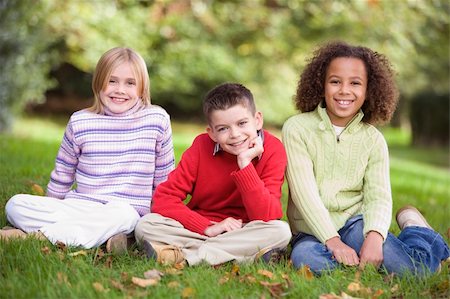 Group of children sitting in garden looking to  camera Stock Photo - Budget Royalty-Free & Subscription, Code: 400-04035142