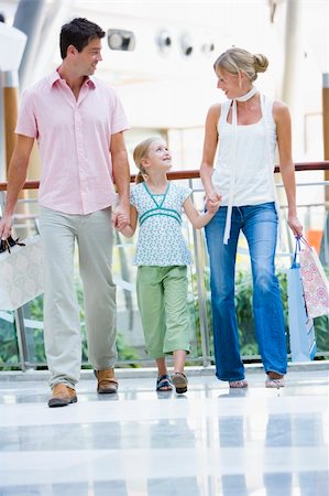 Family shopping in mall carrying bags Stock Photo - Budget Royalty-Free & Subscription, Code: 400-04035934