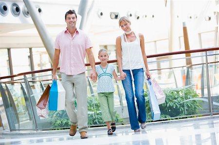 Family shopping in mall carrying bags Stock Photo - Budget Royalty-Free & Subscription, Code: 400-04035933