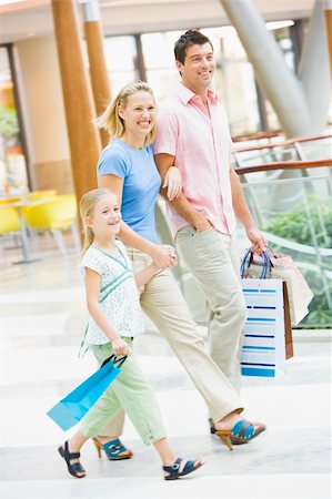 Family shopping in mall carrying mall Stock Photo - Budget Royalty-Free & Subscription, Code: 400-04035946