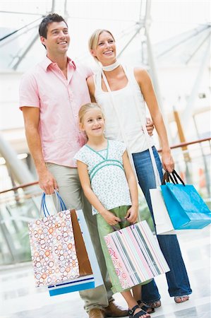 Family shopping in mall carrying bags Stock Photo - Budget Royalty-Free & Subscription, Code: 400-04036038