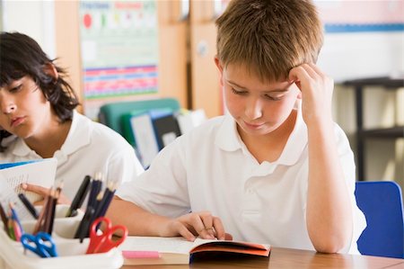 Schoolchildren reading books in class Stock Photo - Budget Royalty-Free & Subscription, Code: 400-04036523