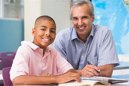 A teacher instructs a schoolboy in a high school class Stock Photo - Budget Royalty-Free & Subscription, Code: 400-04036653