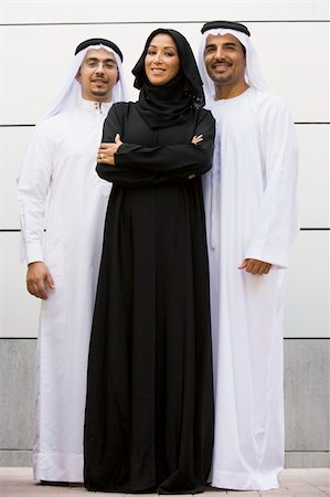 Two Middle Eastern businessmen standing with a woman Stock Photo - Budget Royalty-Free & Subscription, Code: 400-04036992