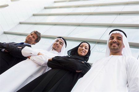 Middle Eastern and Caucasian business workers standing outside a Stock Photo - Budget Royalty-Free & Subscription, Code: 400-04037007