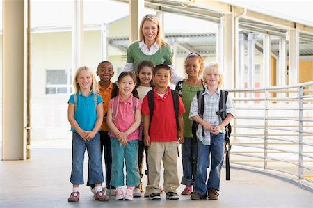 Kindergarten teacher standing with children in corridor Stock Photo - Budget Royalty-Free & Subscription, Code: 400-04037858