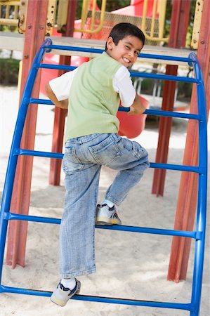 Boy on climbing frame in playground Stock Photo - Budget Royalty-Free & Subscription, Code: 400-04038306