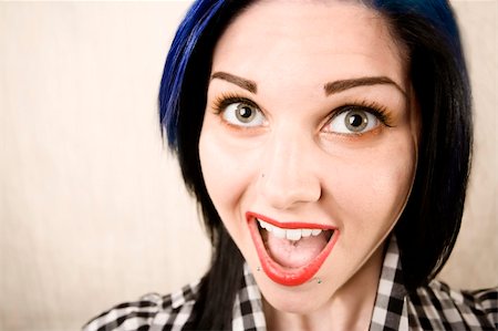 simsearch:400-04016564,k - Wide angle portrait of a cute rockabilly woman laughing Stock Photo - Budget Royalty-Free & Subscription, Code: 400-04038965