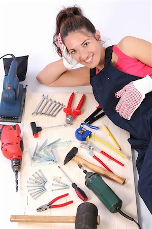 simsearch:400-03947919,k - woman carpenter with work tools on wooden plank Stock Photo - Budget Royalty-Free & Subscription, Code: 400-04039016