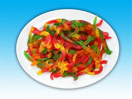 A plate of colorful worm shaped jelly candies. Including clipping path. Stock Photo - Budget Royalty-Free & Subscription, Code: 400-04030290