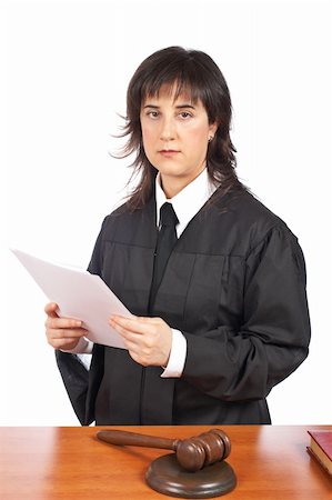 simsearch:700-00028739,k - A female judge in a courtroom reading the verdict and striking the gavel. Shallow depth of field Stock Photo - Budget Royalty-Free & Subscription, Code: 400-04030319