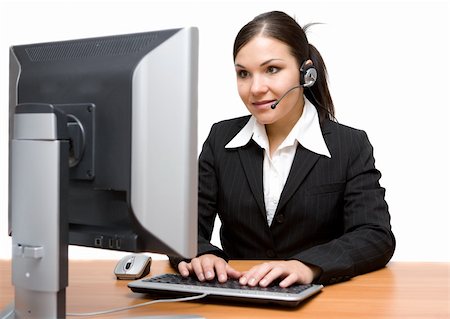 attractive brunette woman in office with headphone Stock Photo - Budget Royalty-Free & Subscription, Code: 400-04030353