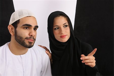saudi arabia people - Emirati Arabian Married Couple Looking In Amusement Stock Photo - Budget Royalty-Free & Subscription, Code: 400-04030740