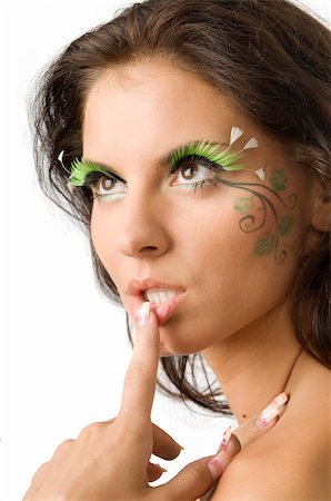 cute and sensual brunette with a finger against the lip and green artificial eyelashes Stock Photo - Budget Royalty-Free & Subscription, Code: 400-04031925