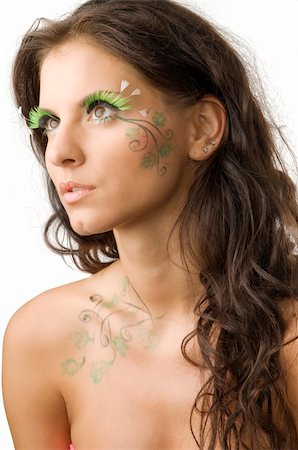 nice and young woman with artificial eyelashes and leaves painted on her Stock Photo - Budget Royalty-Free & Subscription, Code: 400-04031926