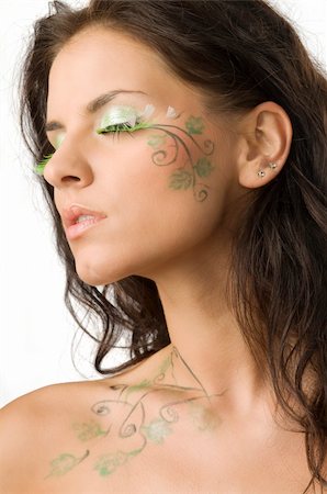 beautiful girl with body paint on her face and shoulder keeping her eyes closed Stock Photo - Budget Royalty-Free & Subscription, Code: 400-04031929