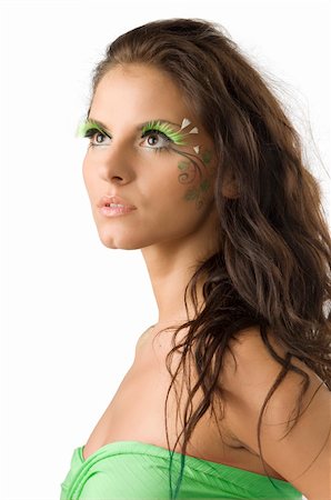 pretty girl with artificial green eyelashes and leaf painted on her face Stock Photo - Budget Royalty-Free & Subscription, Code: 400-04031923