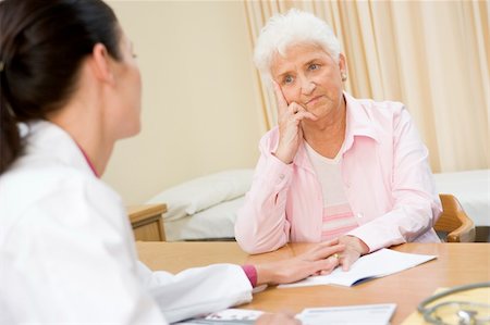 distressed female physician - Woman in doctor's office frowning Stock Photo - Budget Royalty-Free & Subscription, Code: 400-04044239