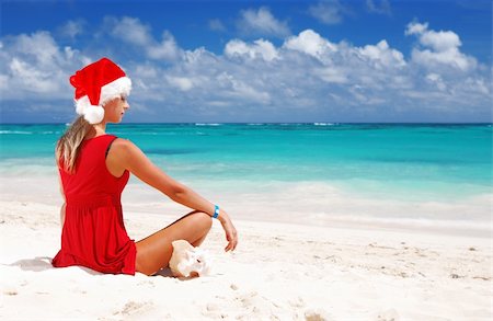 simsearch:400-03991814,k - Woman on the beach in santa's hat Stock Photo - Budget Royalty-Free & Subscription, Code: 400-04047263