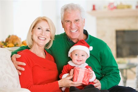 picture of santa with cute babies - Grandparents With Baby In Santa Outfit Stock Photo - Budget Royalty-Free & Subscription, Code: 400-04048090