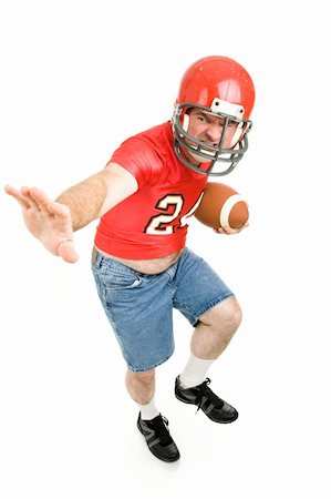 fat man balls - Middle aged man in his high school football jersey and helmet, reliving his past.  Isolated on white. Stock Photo - Budget Royalty-Free & Subscription, Code: 400-04040335