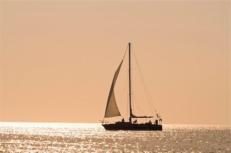 simsearch:400-07748817,k - People on a sail boat at the sunset Stock Photo - Budget Royalty-Free & Subscription, Code: 400-04040371